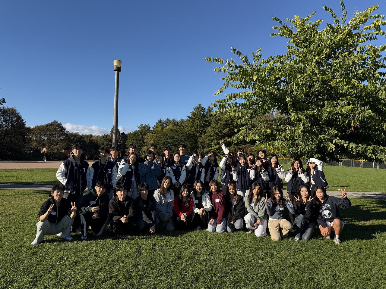 UTKCC members posing for a group photo in the park