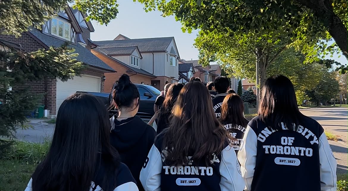 Members walking together in varsity jackets